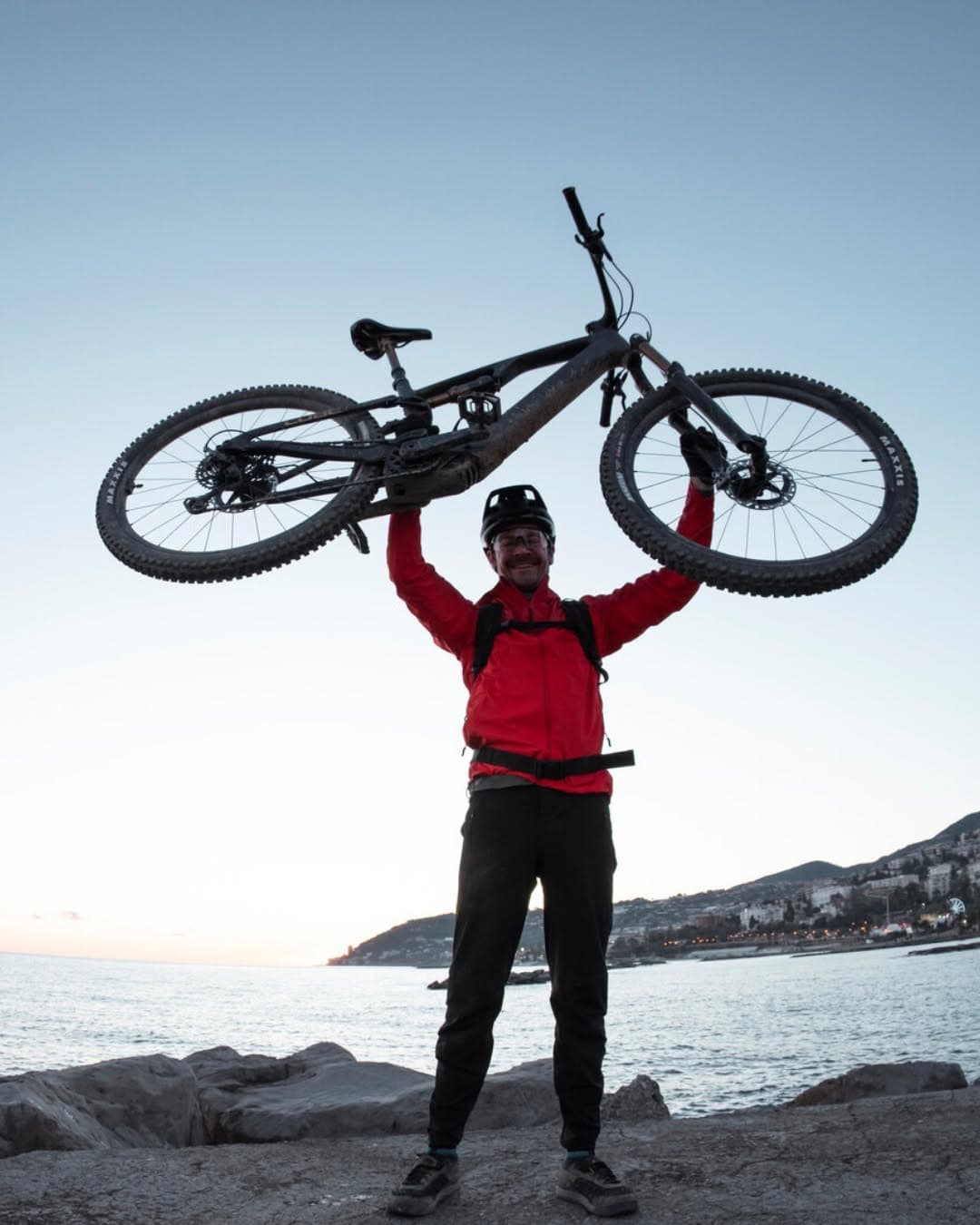 Guy holding a bike